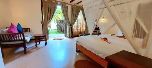 Quarto apresentado na galeria do Kena Beach Hotel, em Matemwe